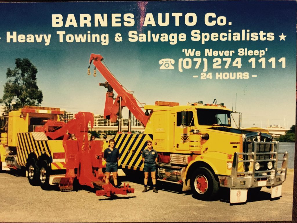 our history archived photo, two barnes trucks with title "heavy towing & salvage specialists"